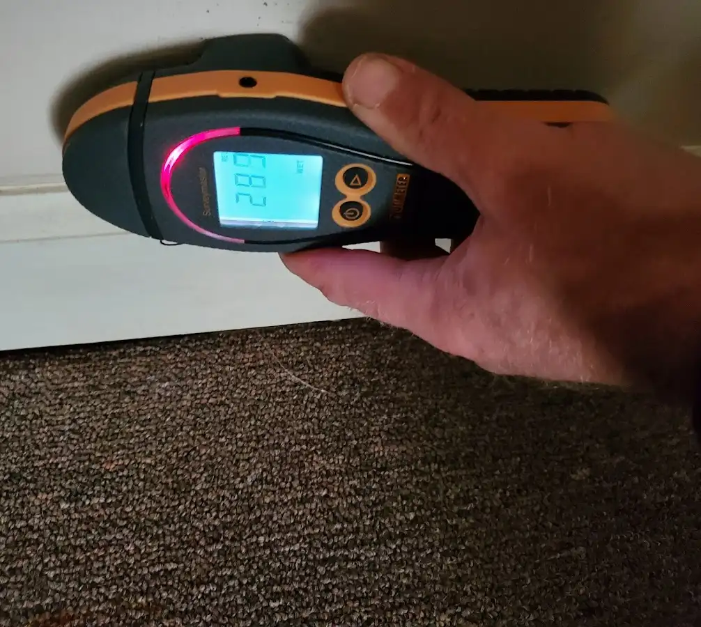 Moisture detection at baseboard during Storm Damage Restoration in Acton